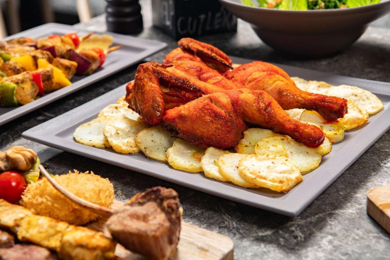 Park Inn By Radisson Makkah Aziziyah Mekka Eksteriør billede A plate of chicken pakora